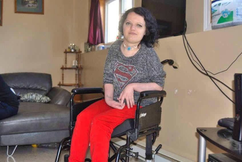 Samantha Cull sits in her wheelchair. The chair, which went missing on Sunday after accidently being left outside her home in Corner Brook, was returned Wednesday morning.