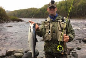 Tony Pottle of Stephenville poses for a photo with an Atlantic salmon he caught on Southwest Brook on the opening day of the 2017 angling season Thursday.