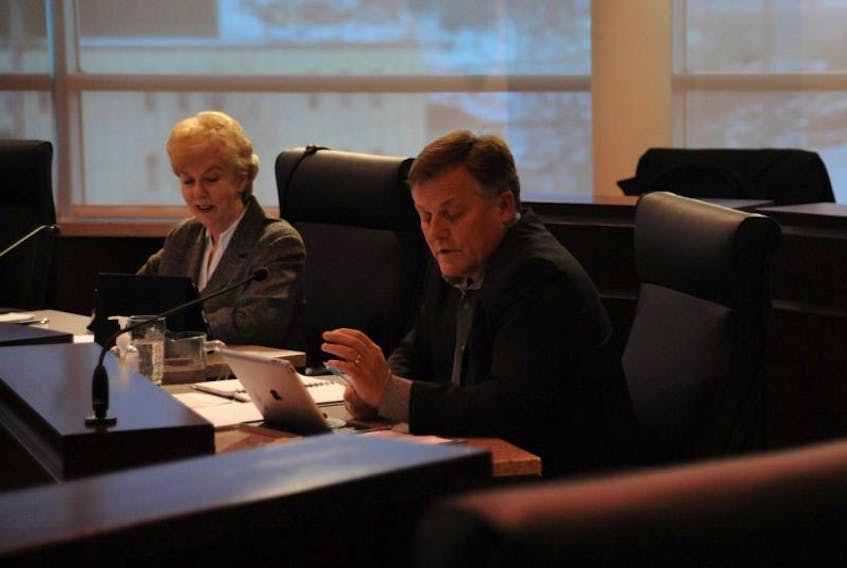 Coun. Josh Carey speaks during Monday night’s meeting of city council. Coun. Mary Ann Murphy is shown in the background.