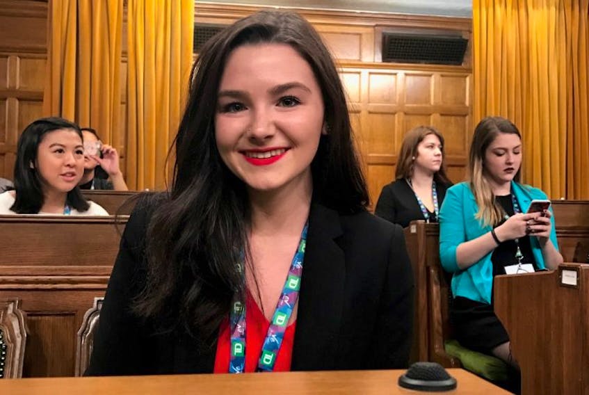 Bethany Bernier of St. George’s is seen sitting in MP Gudrid Hutchings seat in Parliament as part of Daughters of the Vote activities in Ottawa this week.