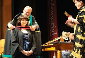 ['Kayla Curlew was the big award winner from the Western Regional School of Nursing’s Class of 2017. Shown here receiving her bachelor of nursing degree at the Grenfell Campus, Memorial University convocation ceremony in Corner Brook Thursday, the graduate from Botwood won three awards. She won the University Medal for Academic Excellence in the nursing program, along with the Western Regional Health Authority Fourth Year Academic Award for having the highest average in courses done during her final year of study and the Western Regional Health Authority Graduate Academic Award for the highest average in the program overall.']