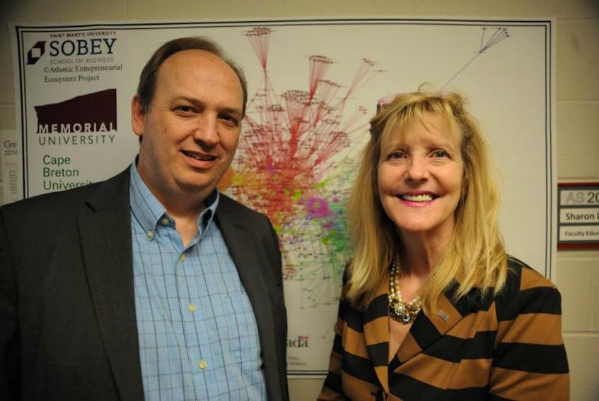 Ken Carter, of Memorial University’s Grenfell Campus, and Ellen Farrell, a professor at St. Mary’s University, discuss the mapping out of the Atlantic Canada entrepreneurial ecosystem in Corner Brook Thursday.