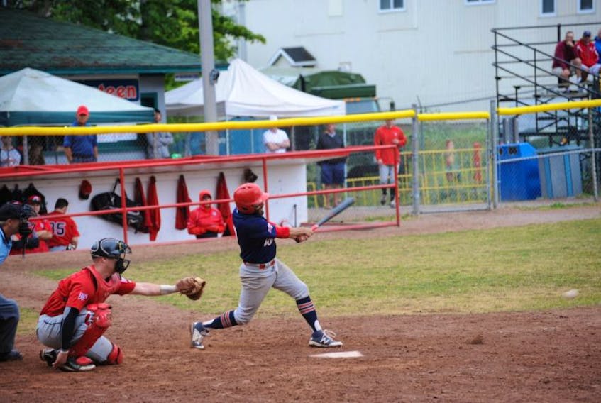 Aaron Flood of the Corner Brook Barons drills a pitch hard to the left side for a groundout against the St. John’s Capitals in Game 1 of the provincial Molson Senior A baseball final.