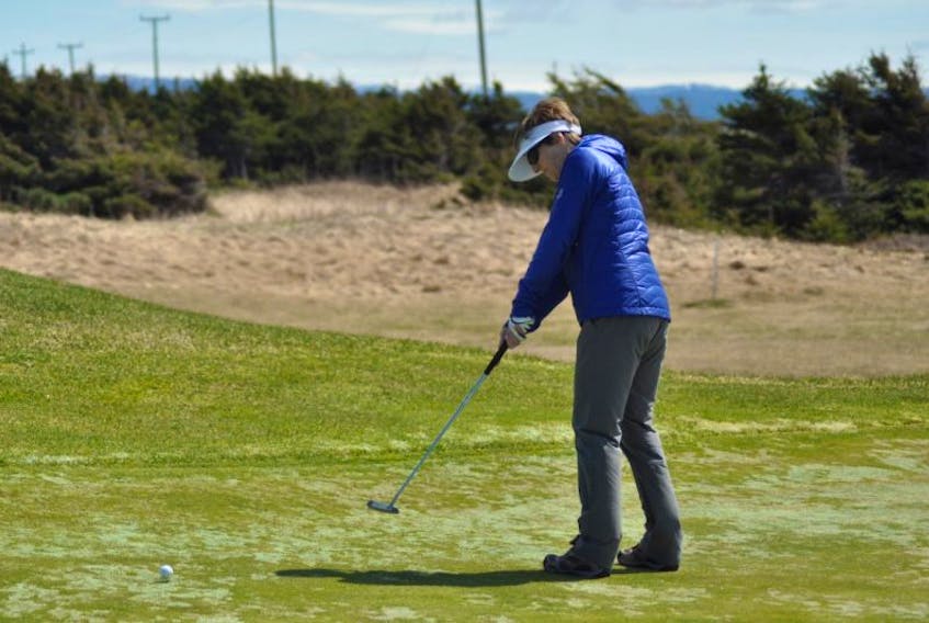Norma Chapman of Stephenville makes a putt on one of the greens at Harmon Seaside Links. The 18-hole course in Stephenville is open for the season.