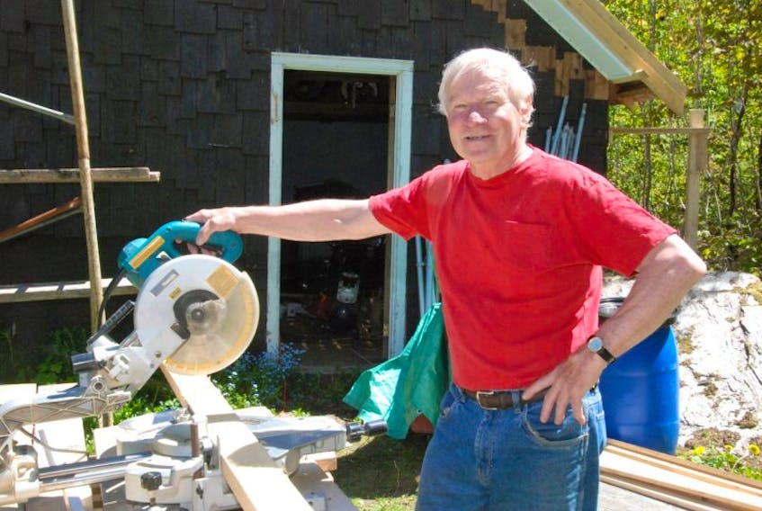 Earle Pike poses for a photo in his garden at his home in Little Rapids. Pike, who spends a fair amount of his retirement building things, was inducted into the Newfoundland and Labrador Volleyball Association Hall of Fame in the builder category over the weekend.