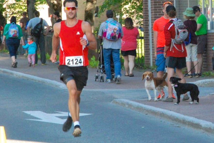 Lee Churchill makes his way along West Street en route to another win at the Corner Brook BMO Downtown Dash Thursday in Corner Brook.