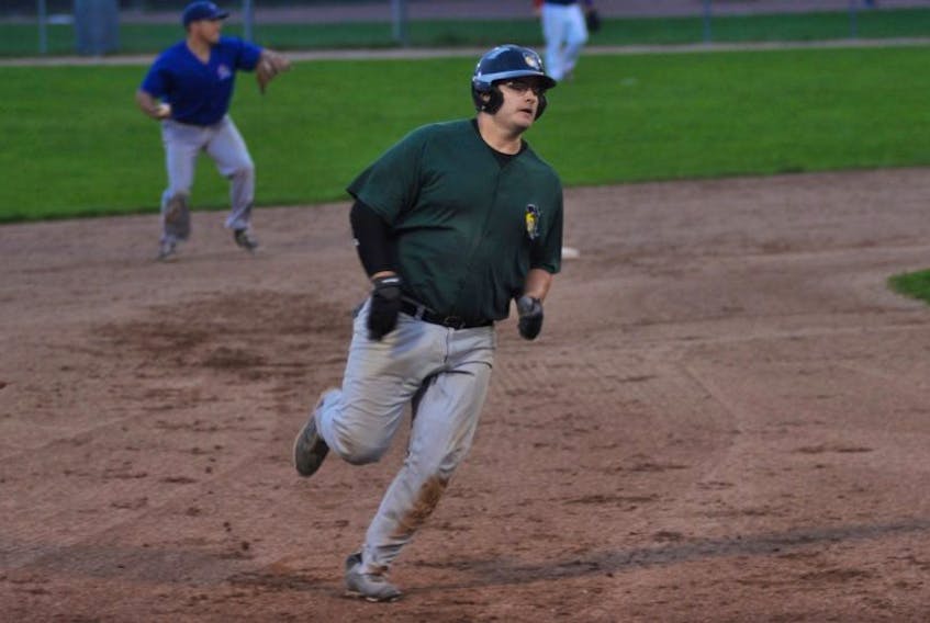Veitch’s Ultramar Hawks’ Ian Griffin dashes towards third base as the play to first is made in the Wing n’ It Curling Marlins’ infield behind him on Thursday night at Jubilee Field.