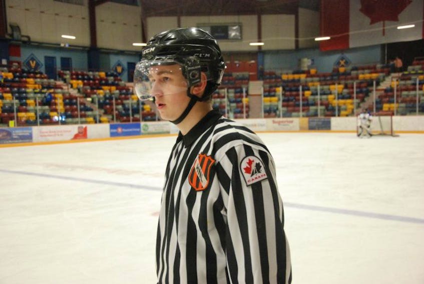 Corner Brook’s Noah Veitch keeps a close eye on the action as a linesman for a round-robin game between the Corner Brook Royals and Conception Bay Renegades at the provincial peewee B hockey tournament in Corner Brook.