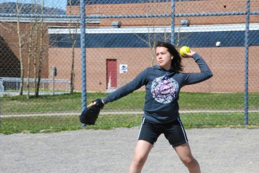Joey Michel plays catch with Danielle Hurley (not shown) at Ambrose O’Reilly Memorial Field Thursday afternoon. The two girls are looking forward to playing softball together this summer with the creation of the Western Newfoundland Minor Softball League.