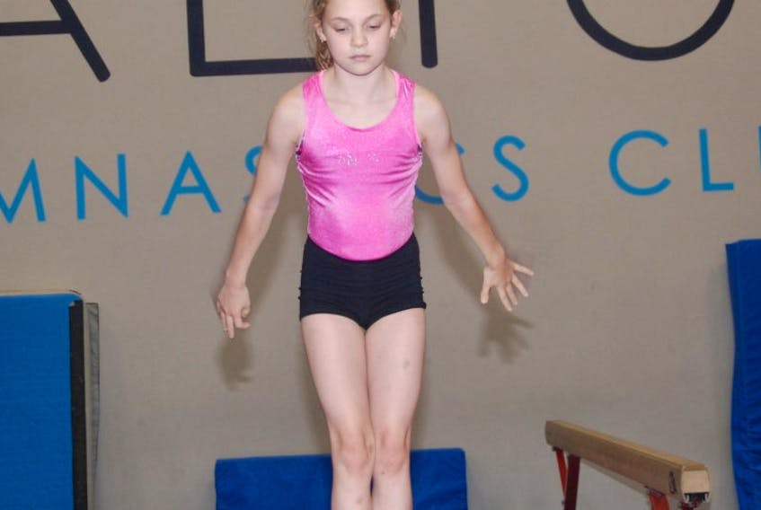 Ellie Hamilton, a 10-year-old gymnast with Saltos Gymnastics Club in Corner Brook, works on her beam routine Wednesday at the Saltos training facility.