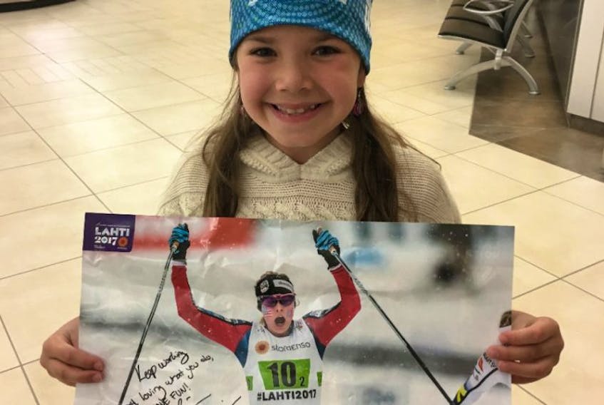 Charlotte Wareham is all smiles after receiving some special gifts from American nordic ski star Jessie Diggins. Clay Diggins, father of the world-class athlete known for inspiring young girls to be the best they can be, presented the gifts to Charlotte at Deer Lake Airport Friday night when he arrived in the province with a group of friends for another moose hunting expedition.