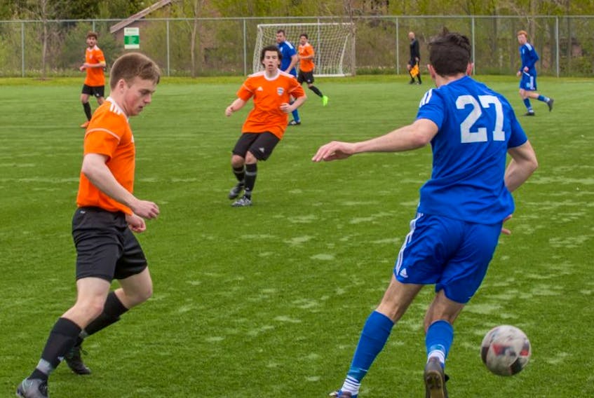 Steers Insurance Corner Brook United FC’s Ethan Allen (left) makes a move for the ball against St. Lawrence’s Gordon Pike during Challenge Cup soccer league play at Wellington Street Sports Complex.