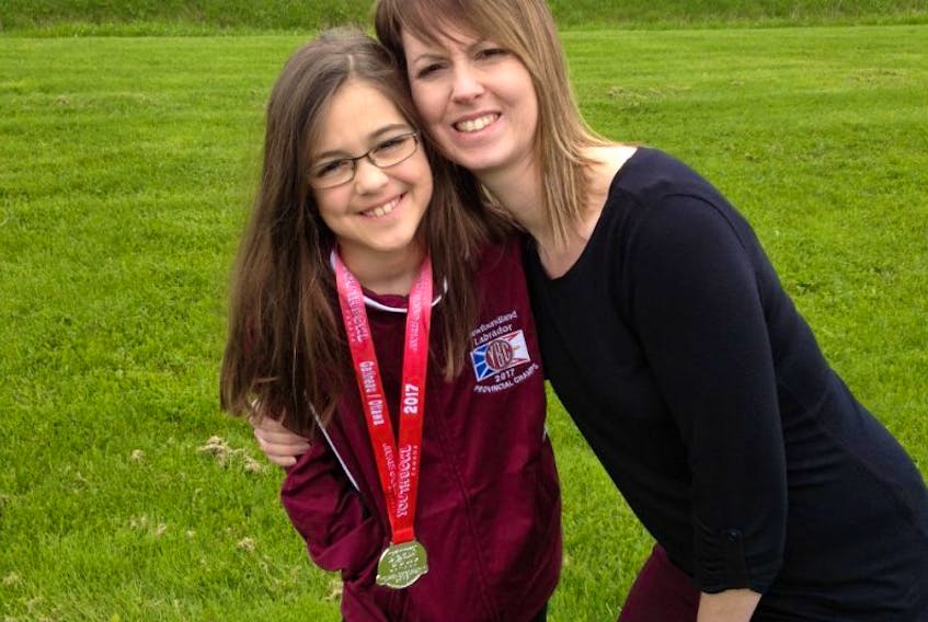 Brooklyn Stride poses with her mom, Jennifer Stride, in Gatineau, Que., Tuesday afternoon. Stride, a nine-year-old Corner Brook native, won a silver medal in bantam girls singles at the 2017 YBC Nationals in Gatineau.