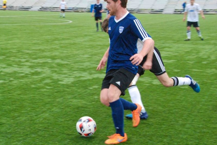 Alex Hennessey of Steers Insurance Corner Brook United eludes a partially obscured member of the CBS Strikers earlier this season.