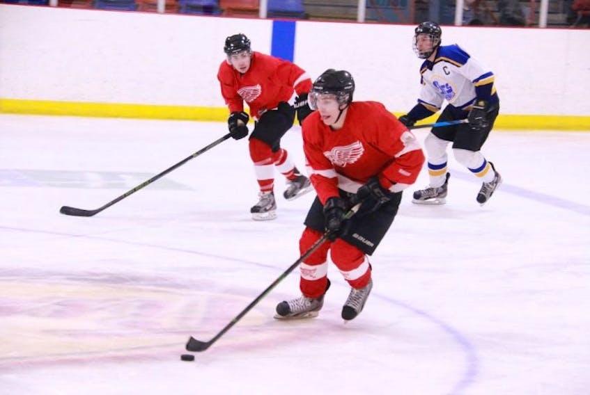 ['Rocky Harbour native Luke Parsons carries the puck up the ice during Friday’s senior hockey league matchup against the visiting Stephenville Jets.']