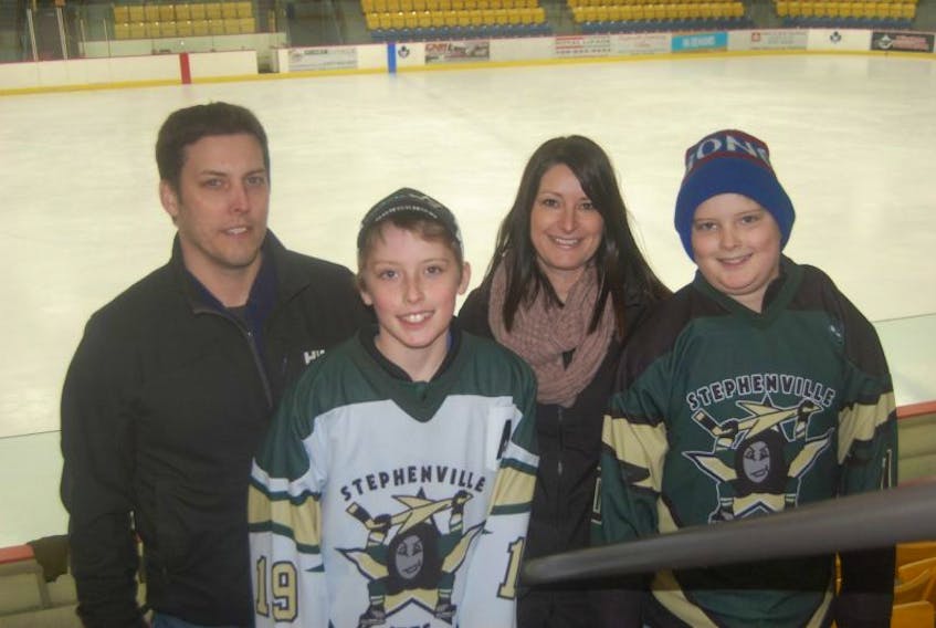 Minor hockey is a family affair for the Dutcher family of Stephenville, with the boys (from left) Liam and Jack both players with the Stephenville Minor Hockey Association, and mom and dad, David and Amanda, supporting them along the way. The family, like many across the province, is celebrating Minor Hockey Week.