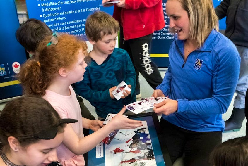 Marie-Philip Poulin is welcomed home from the 2018 Winter Olympic Games in Pyeongchang, South Korea, by members of the Dawson Boys &amp; Girls Club in Verdun on Tuesday, April 3, 2018. 