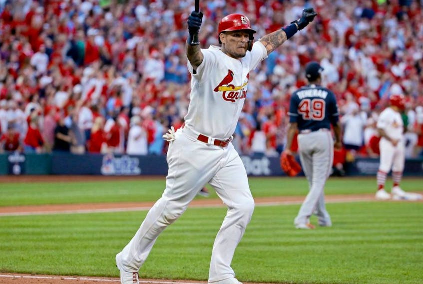 Yadier Molina of the Cardinals celebrates as he hits a walk-off sacrifice fly to give his team the 5-4 win over the Braves in Game 4 of the National League Division Series at Busch Stadium in St Louis on Monday, Oct. 7, 2019.