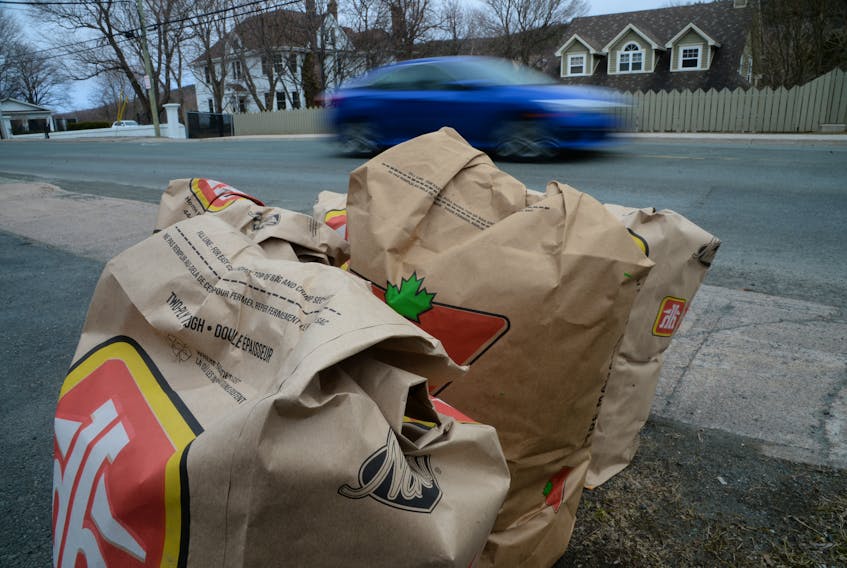 Uncollected yard waste in St. John’s on Tuesday. The city is asking residents to store yard waste bags until the program can be safely implemented. -KEITH GOSSE/THE TELEGRAM