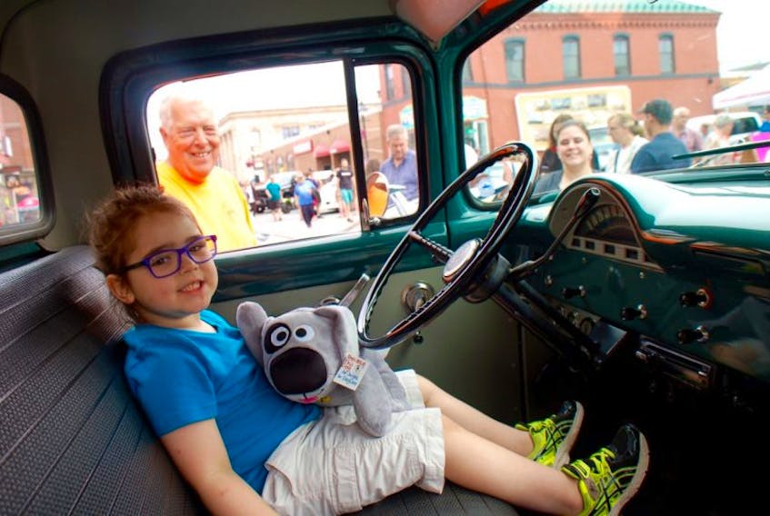 <p>Ted Peach, a car show participant from Marblehead, Massachusetts, presented five-year-old Lucas Parent with a comfort toy called Trouble on Saturday. The toy is a global children’s character connected with a book called “Where’s there’s Trouble, There’s Hope.”</p>