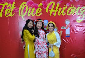 Cape Breton University students Tram (Grace) Le, left, Jenny Le, centre, and Mia, right, at a Lunar New Year celebration in January, 2020. CONTRIBUTED