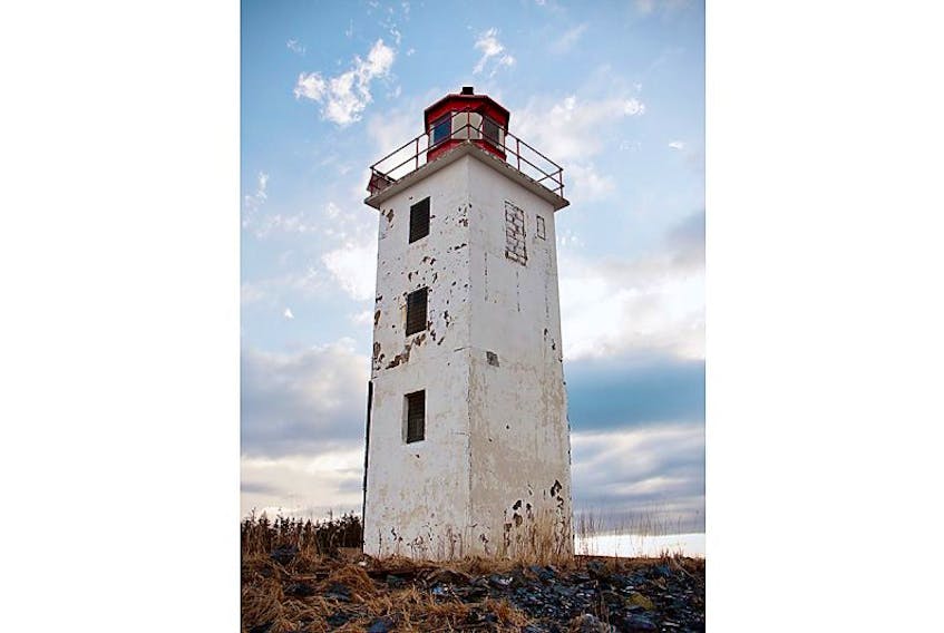The Caribou Island lighthouse stands as a single structure now that a lower building has been removed. A community group is working with the federal government, coast guard and municipality in hopes of taking over control of it so that it can be made to look more attractive for the public and Caribou Island residents.