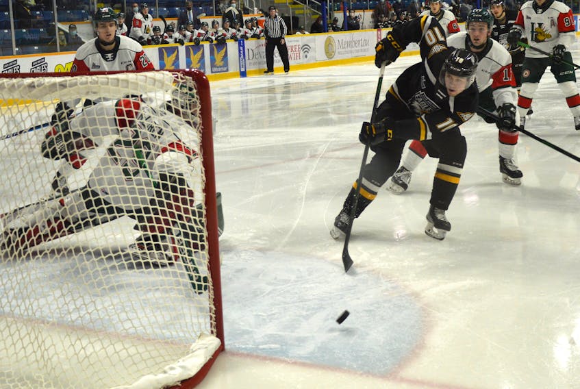 Connor Trenholm of the Cape Breton Eagles, right, misses an open net as former Halifax Mooseheads netminder Cole McLaren attempts to make a save during Quebec Major Junior Hockey League action earlier this season at Centre 200 in Sydney. Cape Breton will host Halifax tonight at 7 p.m. JEREMY FRASER • CAPE BRETON POST