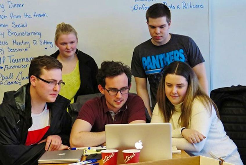 <span class="COLOURKicker">Members of PC Youth of P.E.I. met at the UPEI campus Tuesday and spent a bit of time looking online at federal budget coverage. Attending were, from left, William McGuigan, Courtney Gunn, Brendan Curran, president of the group, Colin Trewin and Sydney Gallant. The tax-free, non-repayable Canada Student Grants for youth attending post-secondary education will rise about 50 per cent. Now it will be $3,000 per year for students from low-income families; $1,200 per year for middle-income students; and $1,800 per year for part-time students.</span>