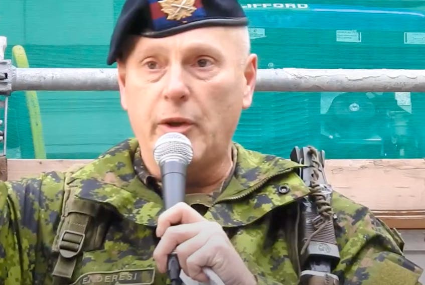 A Canadian Forces member, introduced by organizers of an anti-lockdown rally as Leslie Kenderesi speaks at the gathering in Toronto. (Screenshot from YouTube video)