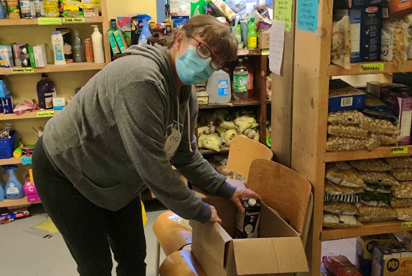 A volunteer works on filling an order at the Shelburne Loyalist Food Bank. Contributed