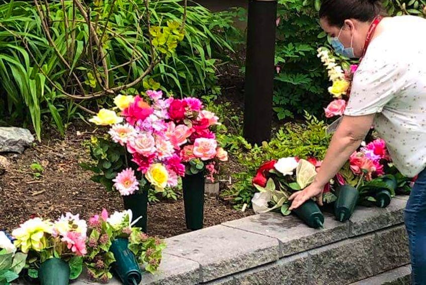 Memorial bouquets for Nova Scotia’s 62 victims of COVID-19 (as of June 15) are placed in the courtyard at the Northwood long term care facility in Halifax. The bouquets were made by Elizabeth and Geoff Riddell, Shelburne. Contributed.