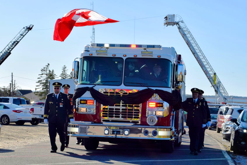 Woods Harbour fire chief Gordie Ross is escorted by his firefighting brothers as he takes one last ride. KATHY JOHNSON