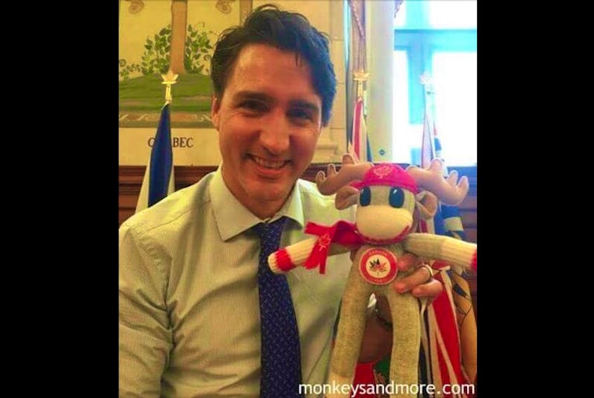 Prime Minister Justin Trudeau with the Canada 150 sock monkey, named William, taken by Dartmouth – Cole Harbour MP Darren Fisher.
