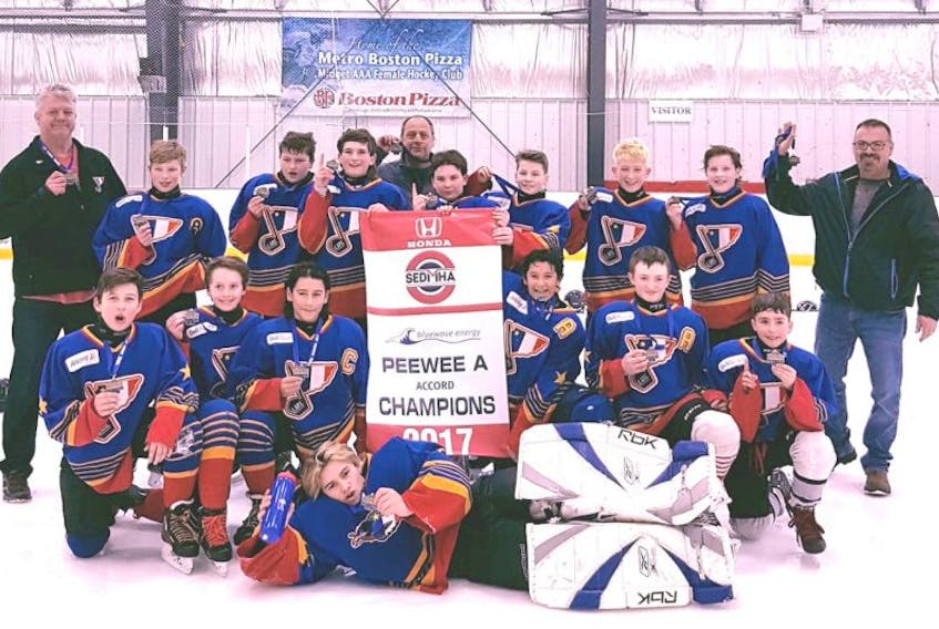 The Clare-Digby Peewee A hockey team are number one after capturing the gold medals and championship banner in the Accord division at the SEDMHA tournament in Dartmouth on April 2.