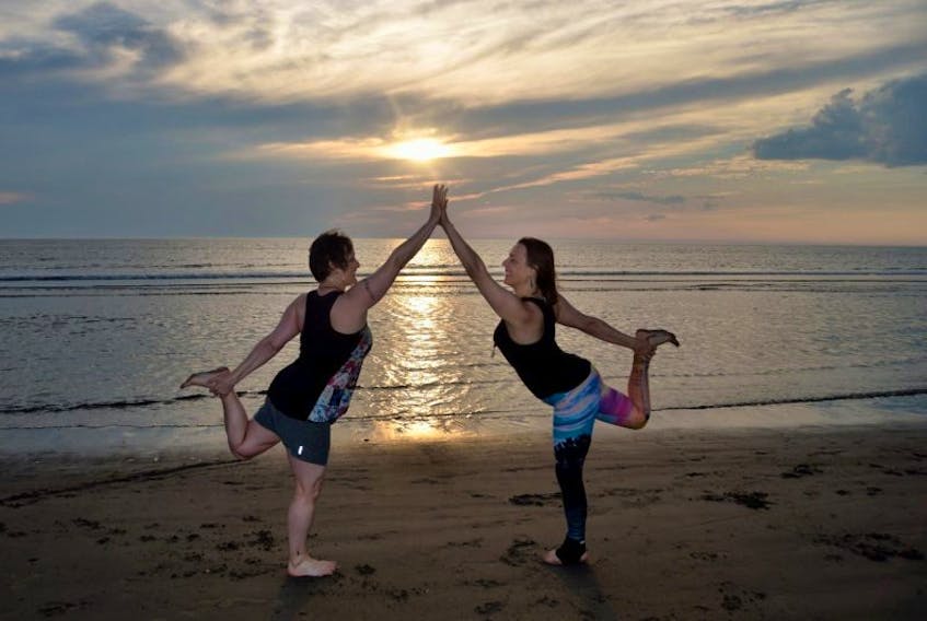 BUCKET LIST: BEACH YOGA: Free beach yoga classes this summer have been increasing in popularity.