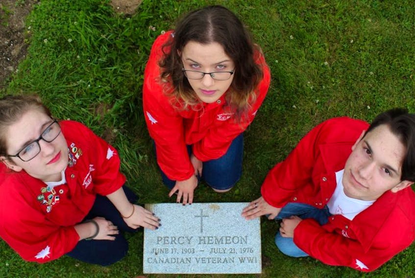 Maple Grove Yarmouth High Memorial Club members Kira Hattie, Zoë Harrington and Danyon Nickerson with one of the slabs they will be unveiling in a ceremony for the unmarked graves of six veterans at Yarmouth Mountain Cemetery on Sunday, July 16 at 2 p.m. The public is invited to attend.