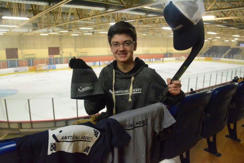 West Pubnico teenager André d’Entremont with some of his Anything Hockey apparel that he sells.