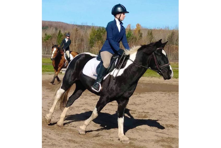 Jerrica Swim at a recent competition with the Acadia equestrian team.