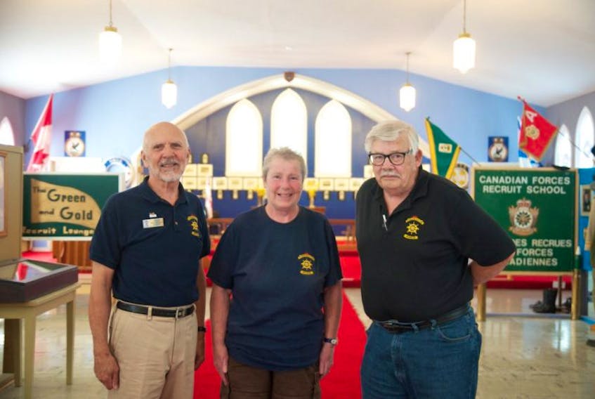 Ken Ilnitski, Gordon Magee and Bev Mosher, members of the Cornwallis Military Museum’s Board of Directors, stand at the centre of its largest exhibit.  The museum will close September 3 after 20 years of operation. “We’ve done all we could. It’s not a money issue – there’s no one willing to volunteer,” said Mosher.