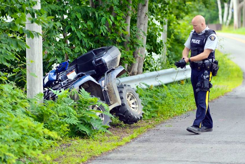 RCMP investigate after an ATV with two riders onboard crashed into a power pole on East Old Post Road at Sunset Drive in Smith's Cove Wednesday, July 12. 