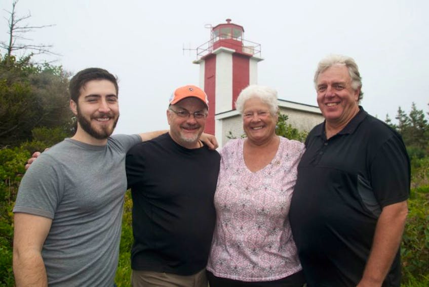 Max and Robert Hersey, Mary Tibbetts and Kevin Ellis stand at Point Prim, which hosted a social and open lighthouse Saturday, September 16.