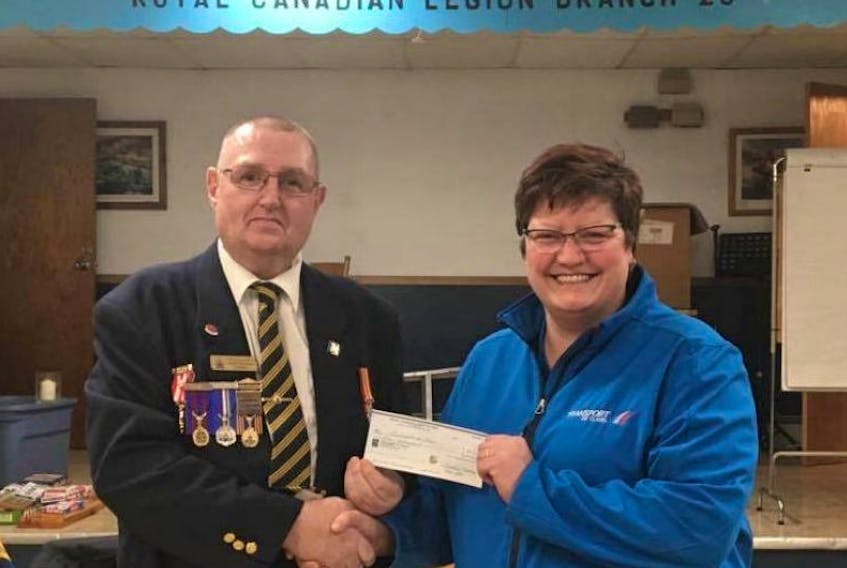 Royal Canadian Legion Branch 20 president Keith Stevens presents a cheque of $1,000 to Cathy Theriault, manager of of Transport de Clare, a charity which provides wheelchair-accessible transport for people across Digby County.