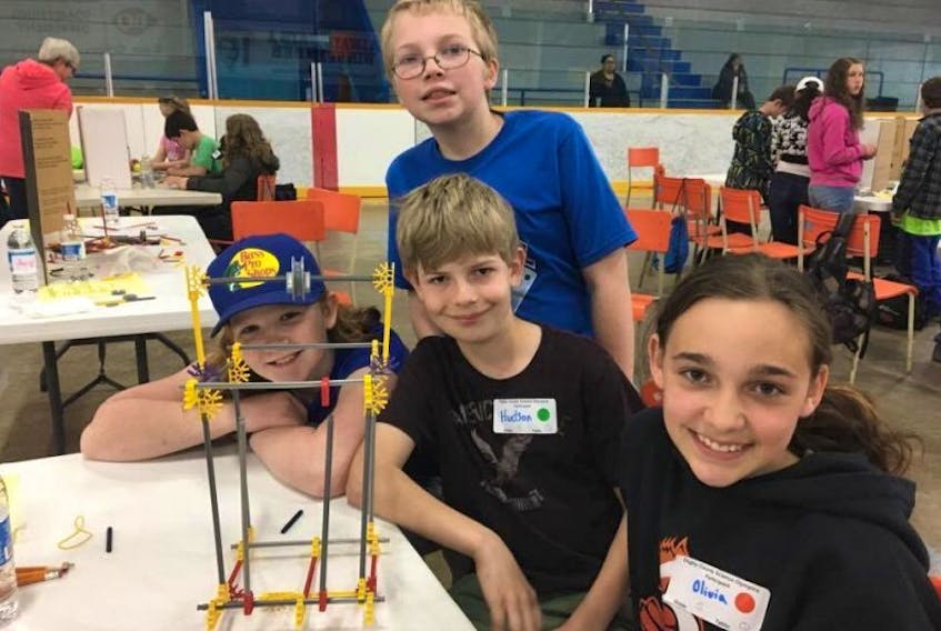 From left: grade 5 students Ashlee Crocker, Logan Perry, Hudson Sollows and Olivia Mcgrath from Islands Consolidated School finish building their cable car.