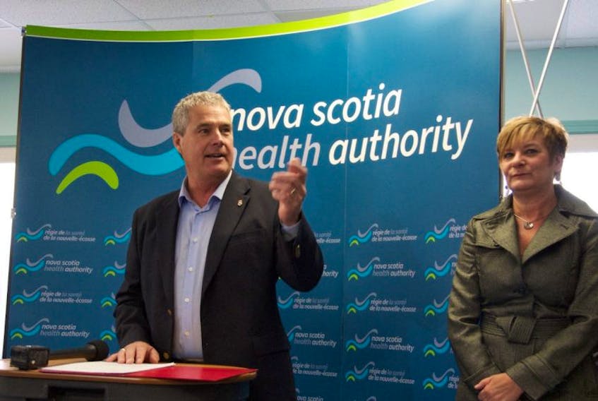 Clare-Digby MLA Gordon Wilson stands with Dr. Carolyn Todd as he announces the hiring of three new doctors and one nurse at the Digby and Area Health Services Centre March 23.