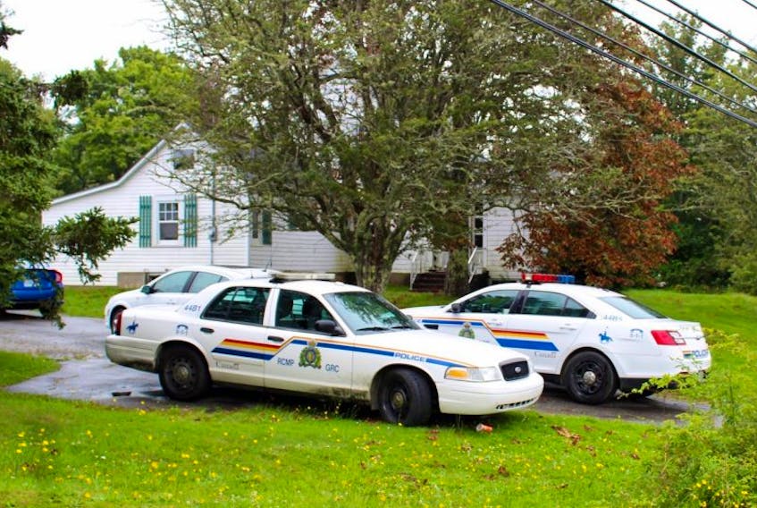 Two RCMP cruisers remained in the driveway of a Hebron residence at noon Wednesday where heavy police activity took place earlier.