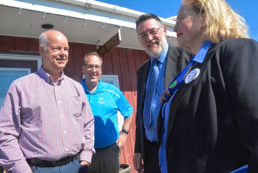 Local PC candidates Chris d'Entremont and Mitch Bonnar stand alongside PC leader Jamie Baillie during a campaign swing through Yarmouth County where he also chatted with Yarmouth riding campaign manager Carole Hill-Bojarski.