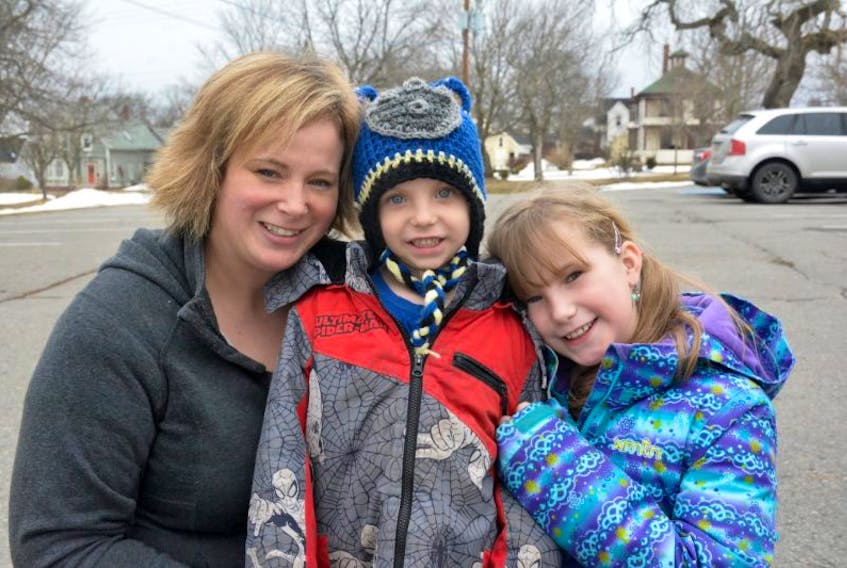 Krista Christie and her children Hunter and Autumn squeeze in for a photo. Hunter has a form of leukemia and his mother says the lack of pediatricians at the Yarmouth Regional Hospital is stressful to the family, and other families as well.