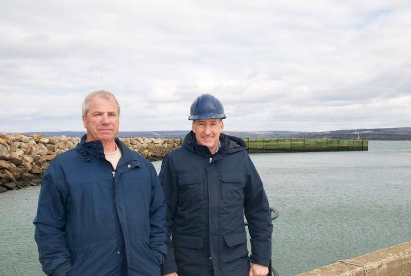Digby Harbour Port Association chair Vance Hazelton and Digby harbour CEO and manager Edwin Chisholm stand in front of the breakwater, which is just one of a series of updates the port has received since it was bought by the association eight years ago. The group are planning an expansion of the port, and will announce their business plan soon.
