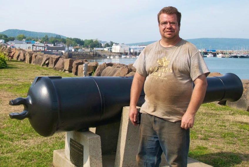 Owen Shaw stands in front of the cannon he found that was defaced August 17 along Admiral’s Walk in Digby. 