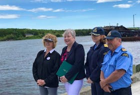 Mayor Karen Mattatall, MP Bernadette Jordan, Anne Miller Canadian Coast Guard and Keith Laidlaw Canadian Coast Guard pose on the government wharf on June 15 where the Farley Mowat currently is berthed.